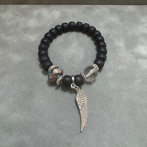 Beaded Stretch Bracelet Lava Stone Wing Charm Elegant Design Handcrafted